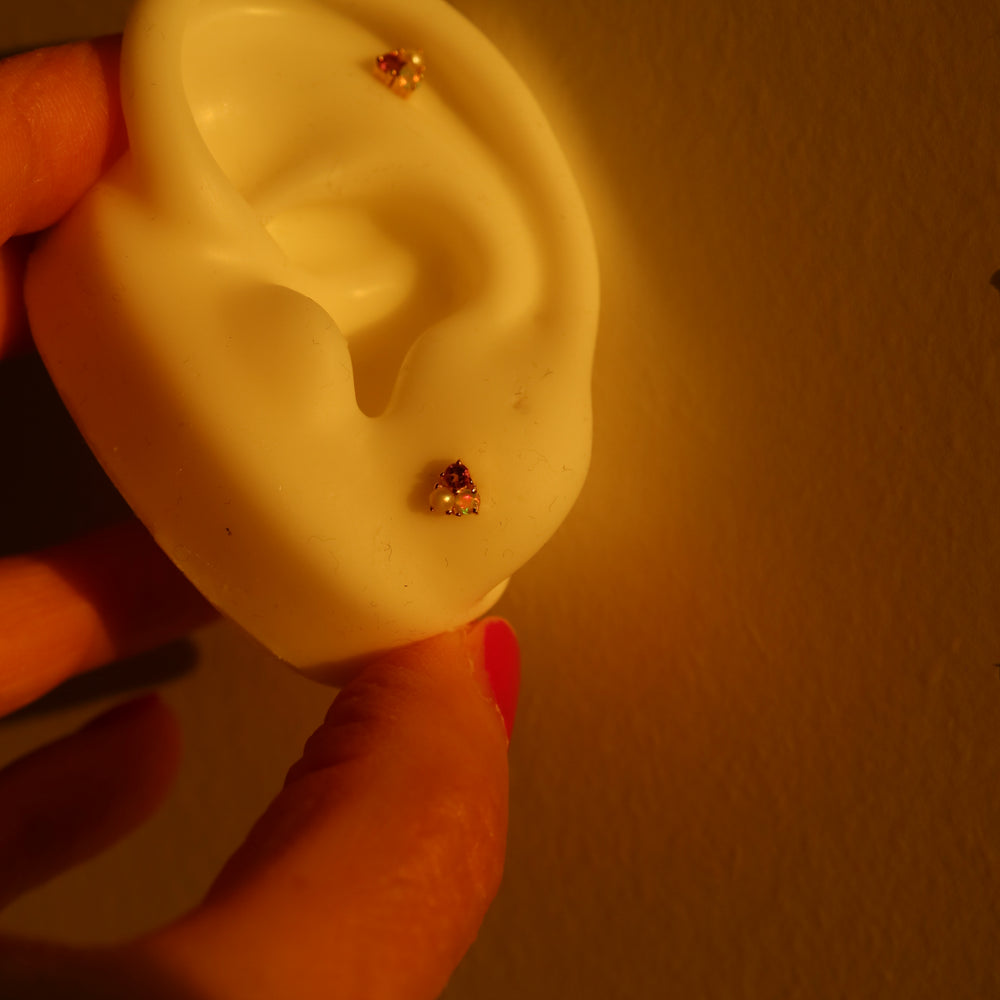 Rhodium-plated sterling silver labret stud earrings with pink tourmaline, Ethiopian opal, and freshwater pearl, ideal for cartilage and helix piercings.