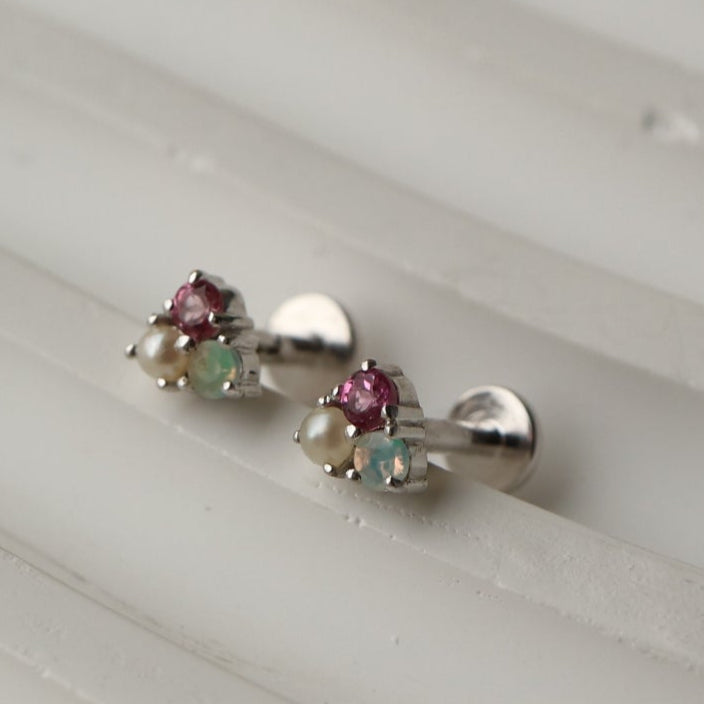 Rhodium-plated sterling silver labret stud earrings with pink tourmaline, Ethiopian opal, and freshwater pearl, ideal for cartilage and helix piercings.